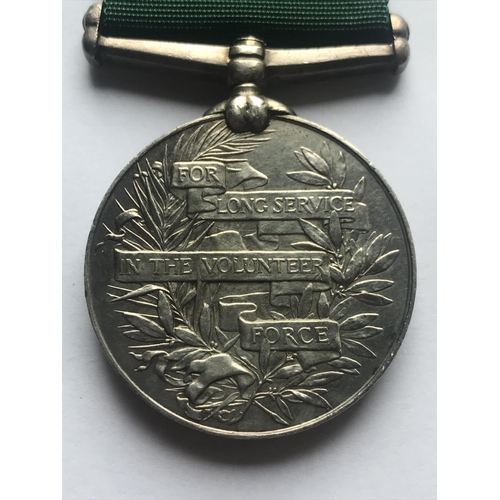 1050 - A GEORGE V VOLUNTEER FORCE LONG SERVICE AWARD. A George V Volunteer Force Long Service award with en... 