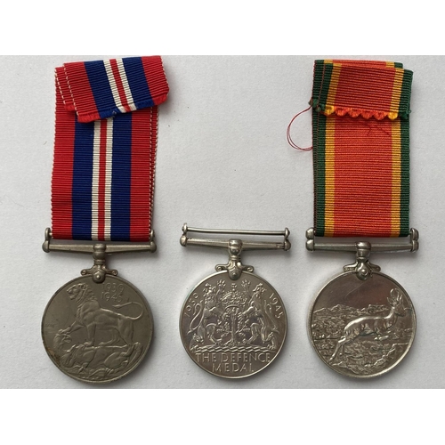 1076 - AN AFRICA SERVICE MEDAL AND TWO OTHERS. An Africa Service Medal, an unnamed example, Defence Medal, ... 