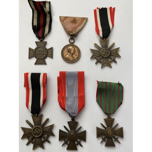 1081 - A COLLECTION OF SIX VARIOUS FIRST AND SECOND WORLD WAR MEDALS. A collection of six awards: A German ... 