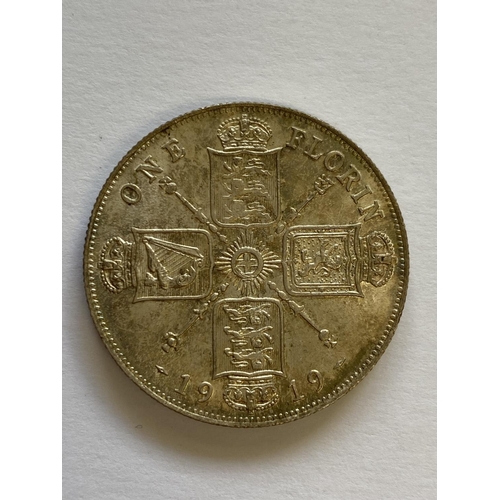 1117 - A GEORGE V FLORIN. A George V Florin, first coinage, bare head, l. dated 1919, with lustrous fields.... 