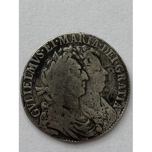 1133 - A WILLIAM AND MARY HALFCROWN. A William and mary Halfcrown dated 1689, conjoined bust r, reverse wit... 