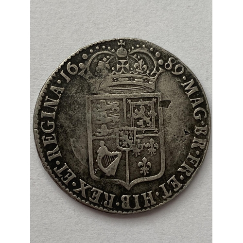 1133 - A WILLIAM AND MARY HALFCROWN. A William and mary Halfcrown dated 1689, conjoined bust r, reverse wit... 