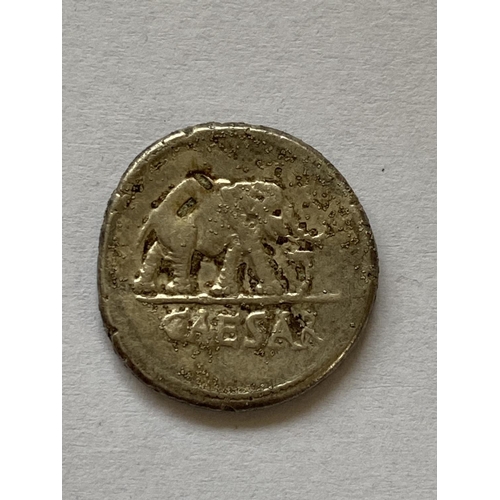 1148 - A JULIUS CAESAR ROMAN IMPERIAL SILVER DENARIUS. Obverse elephant r. above Caesar, reverse with scatt... 