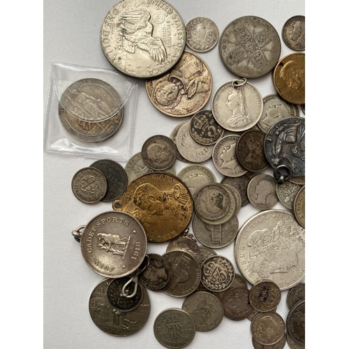 1151 - AN AMERICAN DOLLAR 1887 and OTHER WORLD COINS. A collection of UK and World coins to include a Festi... 