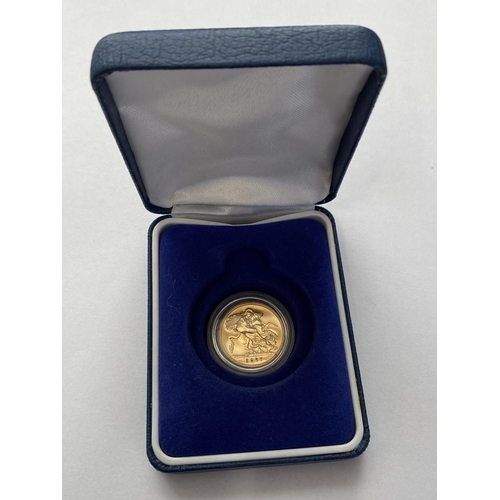 1253 - A GEORGE VI SOVEREIGN. A George VI Sovereign dated 1937, plain edged, encapsulated and in case of is... 