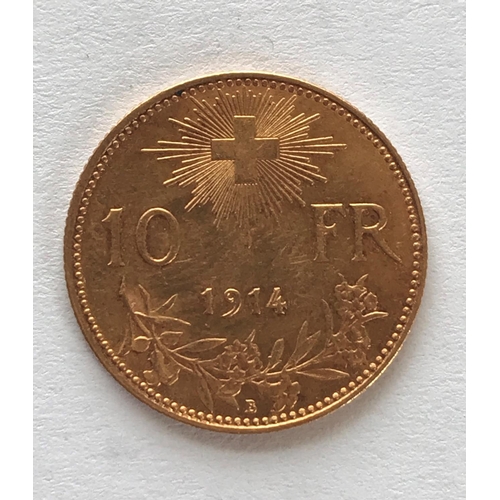 1259 - A SWISS 10 FRANC GOLD COIN. A Swiss 10 Franc Gold coin dated 1914, 3.3g, 8mm.