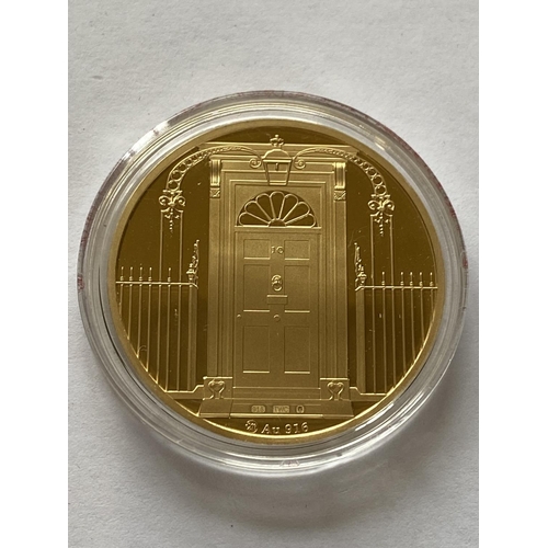 1261 - A BARONESS THATCHER 1 OZ GOLD COMMEMORATIVE COIN. A 22ct 1oz gold commemorative coin, proof containe... 