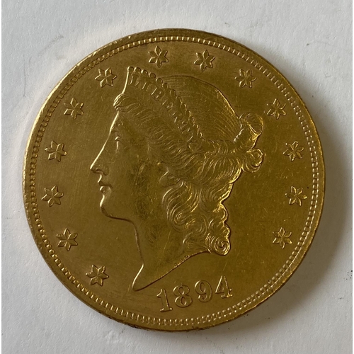 1295 - AN AMERICAN 20 DOLLAR GOLD COIN. A U.S.A. 20 Dollar gold coin dated 1894, in a loose fitting 14ct mo... 