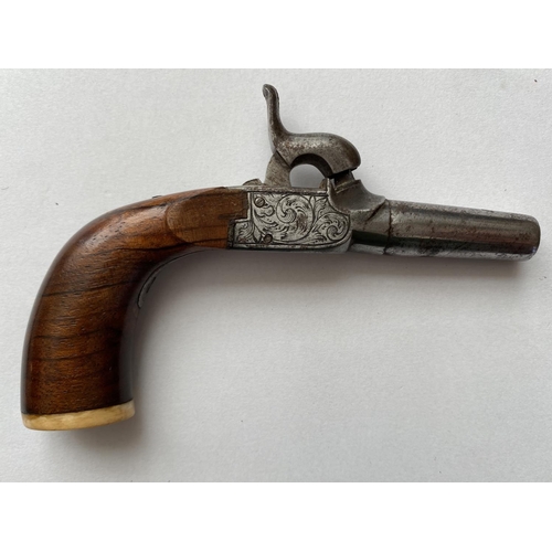 504 - A 19TH CENTURY WAISTCOAT PISTOL. A small percussion action pistol with a 3.8cm screw off barrel, the... 