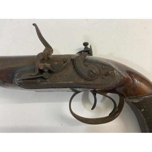 507 - A 19TH CENTURY CONTINENTAL STYLE DOUBLE BARREL PISTOL. An unusual double barrel flint lock pistol wi... 