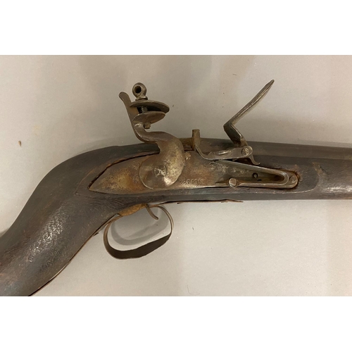 510 - A LONG BARREL JEZAIL FLINTLOCK RIFLE. With a 105cm barrel, the flintlock mechanism with a sideplate ... 