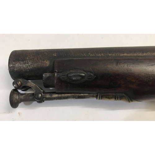 519 - A 19TH CENTURY PERCUSSION CAP FIRING PISTOL. The pistol with a 17.5cm barrel and underslung pivoting... 