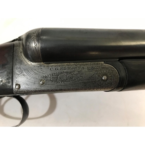 534 - A 12 BORE SHOTGUN BY C.G. EDWARDS AND SON. A 12 Bore shotgun with 70.4cm side by side barrels marked... 