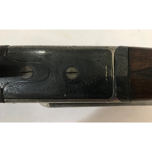 535 - A 12 BORE SHOTGUN BY MANTON AND CO. A 12 Bore Shotgun with 71cm side by side sleeved barrels marked ... 