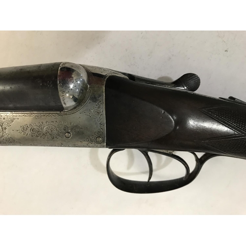 535 - A 12 BORE SHOTGUN BY MANTON AND CO. A 12 Bore Shotgun with 71cm side by side sleeved barrels marked ... 