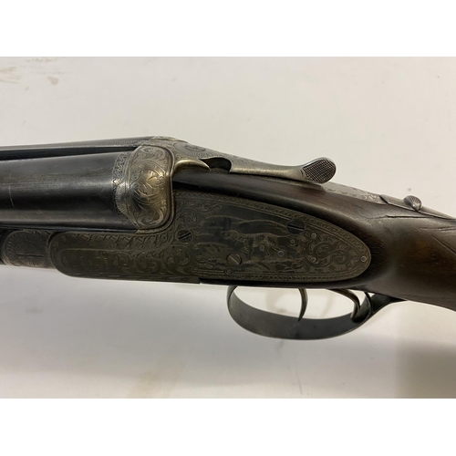 539 - A 12 BORE SPANISH DOUBLE BARREL SHOTGUN. With 70cm sie by side barrels marked 'Made in Spain Especia... 