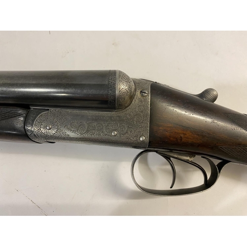 540 - A 12 BORE SHOTGUN BY TOLLEY OF LONDON. With 71cm side by side barrels, engraved to the top 'J & W To... 