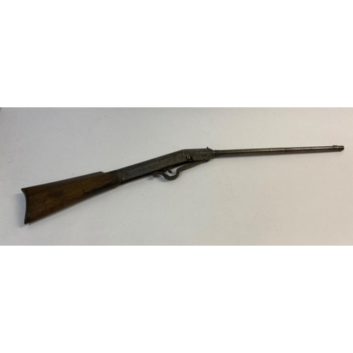 557 - A GEM 177 AIR RIFLE. A GEM air rifle with a 47cm barrel with latch locking at the breech and walnut ... 