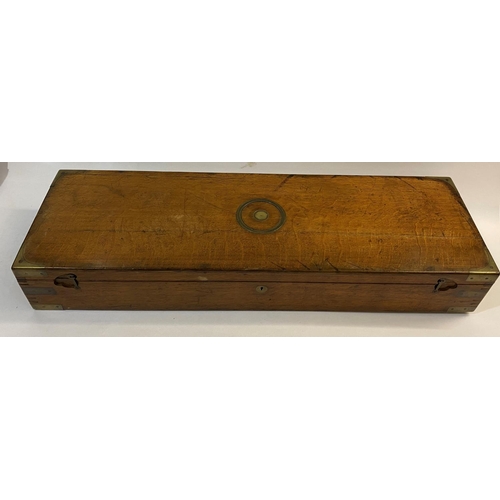 565 - A J. PURDEY OAK GUN CASE AND ACCESSORIES. A large oak gun case, the interior of the lid with a paper... 