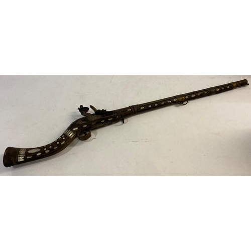 569 - A DECORATIVE 19TH CENTURY FLINTLOCK JEZAIL. A north African Jezail with a 66cm octagonal barrel with... 