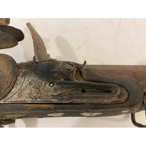 569 - A DECORATIVE 19TH CENTURY FLINTLOCK JEZAIL. A north African Jezail with a 66cm octagonal barrel with... 