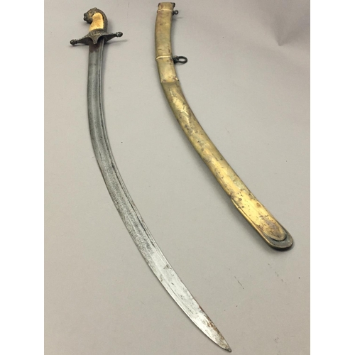 627 - A 19TH CENTURY TURKISH MAMELUKE SWORD AND SCABBARD. The 67cm curved and fullered blade with a sharpe... 