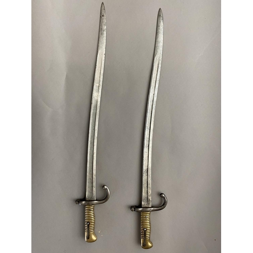 635 - TWO SIMILAR FRENCH CHASSEPOT TYPE BAYONETS. Each with 58cm curved and fullered blades, one marked to... 