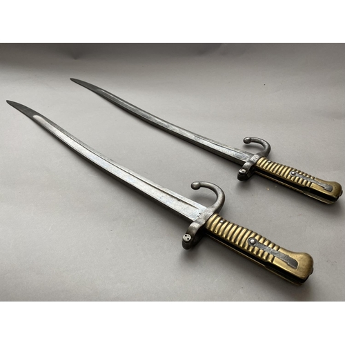 635 - TWO SIMILAR FRENCH CHASSEPOT TYPE BAYONETS. Each with 58cm curved and fullered blades, one marked to... 