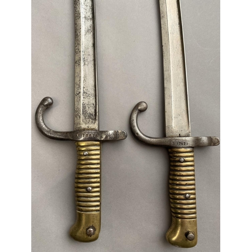 635 - TWO SIMILAR FRENCH CHASSEPOT TYPE BAYONETS. Each with 58cm curved and fullered blades, one marked to... 