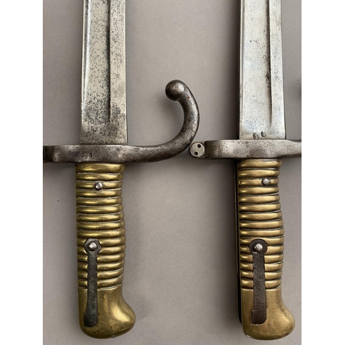 635 - TWO SIMILAR FRENCH CHASSEPOT TYPE BAYONETS. Each with 58cm curved and fullered blades, one marked to... 