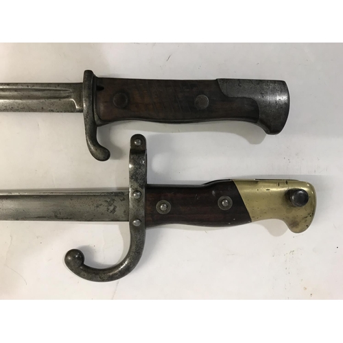 637 - A GERMAN FIRST WORLD WAR M1898 LONG BAYONET AND ANOTHER. An M1898 bayonet with a 52cm fuller and pip... 