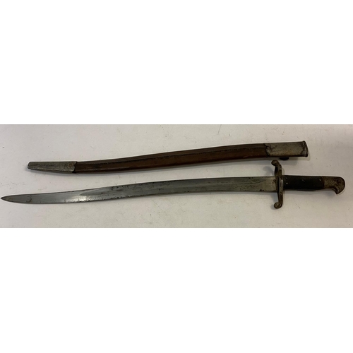 643 - AN 1856 PATTERN YATAGHAN BAYONET AND SCABBARD. With a 58cm serpentine pointed and partially fullered... 