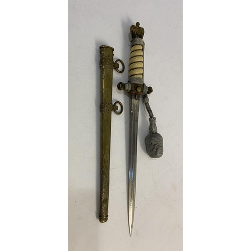 659 - A GERMAN KRIEGSMARINE DAGGER AND SCABBARD. A second World War or later German Kriegsmarine dress dag... 