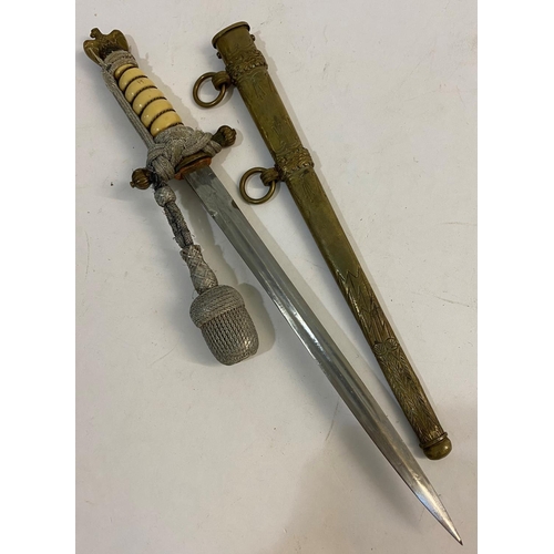 659 - A GERMAN KRIEGSMARINE DAGGER AND SCABBARD. A second World War or later German Kriegsmarine dress dag... 