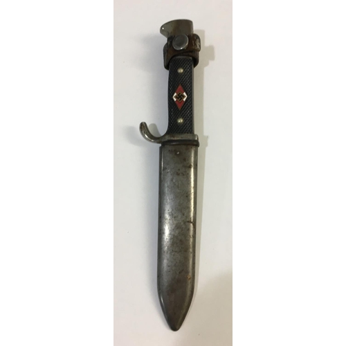 664 - A SECOND WORLD WAR HITLER YOUTH KNIFE AND SCABBARD. With a 13.5cm sharpened pointed blade with motto... 