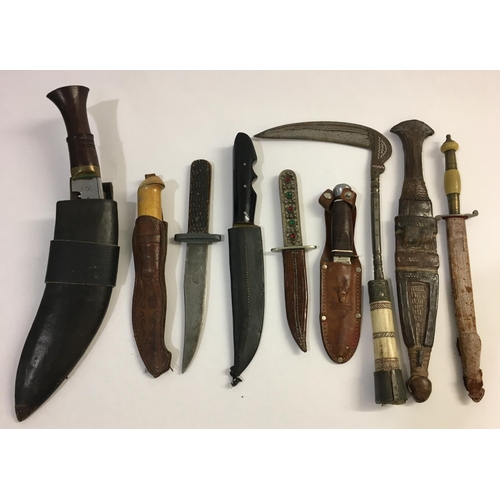 665 - A COLLECTION ON NINE CEREMONIAL AND HUNTING KNIVES. Nine knives, eight with scabbards including a Ku... 