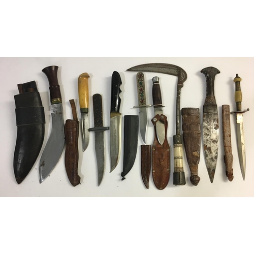 665 - A COLLECTION ON NINE CEREMONIAL AND HUNTING KNIVES. Nine knives, eight with scabbards including a Ku... 