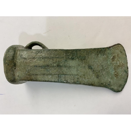 677 - A BRONZE AGE LOOPED AND SOCKETTED AXEHEAD. 1000 - 500 BC, a substantial looped and socketed axe head... 