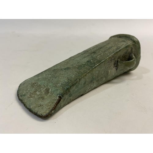 677 - A BRONZE AGE LOOPED AND SOCKETTED AXEHEAD. 1000 - 500 BC, a substantial looped and socketed axe head... 