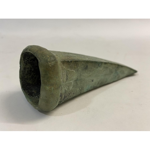 677 - A BRONZE AGE LOOPED AND SOCKETTED AXEHEAD. 1000 - 500 BC, a substantial looped and socketed axe head... 