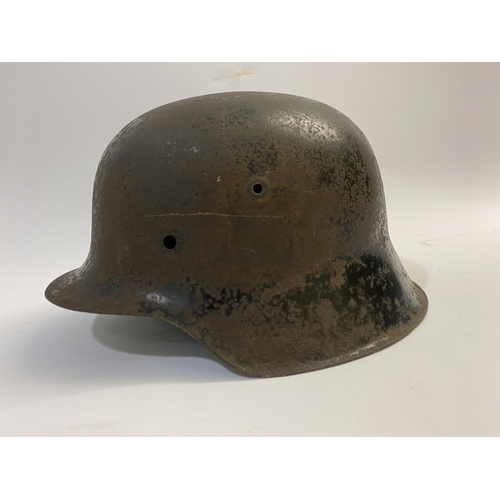 682 - A BLACK WAFFEN SS SINGLE DECAL M40 HELMET. A Second World War or later M40 type helmet shell, with w... 