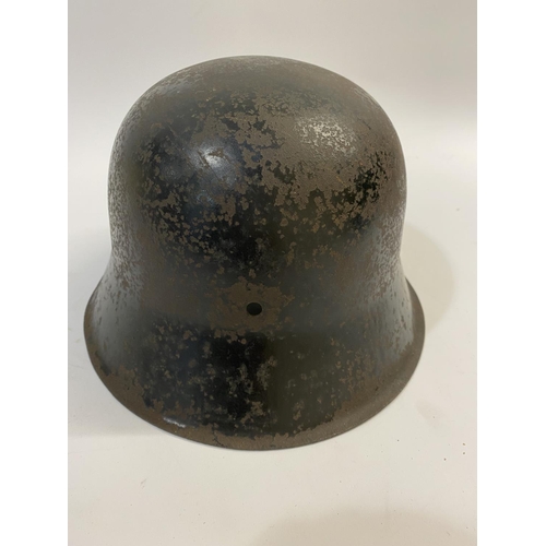 682 - A BLACK WAFFEN SS SINGLE DECAL M40 HELMET. A Second World War or later M40 type helmet shell, with w... 