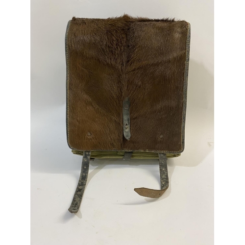 684 - GERMAN SECOND WORLD WAR PONY SKIN PACK DATED 1943. A German pony skin back pack, stamped to the leat... 