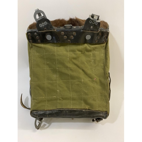 684 - GERMAN SECOND WORLD WAR PONY SKIN PACK DATED 1943. A German pony skin back pack, stamped to the leat... 