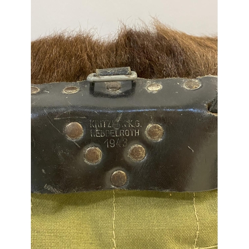 684 - GERMAN SECOND WORLD WAR PONY SKIN PACK DATED 1943. A German pony skin back pack, stamped to the leat... 