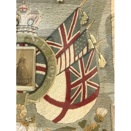 687 - A VICTORIAN SAILOR'S WOOL WORK 'FORGET ME NOT'. The woolwork mounted with a central panel of a Victo... 