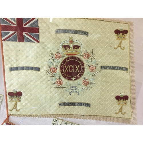 689 - A WILTSHIRE REGIMENT NEEDLEWORK PANEL. A finely worked needlework panel with crossed Colours beneath... 