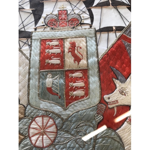 691 - A VICTORIAN NAVAL NEEDLEWORK PANEL. The panel finely worked with a central Royal Coat of Arms with R... 