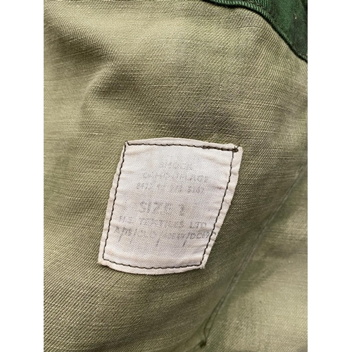 696 - A DENNISON TYPE COMBAT SMOCK, SIZE 2. With a four pocket zip front, label to the inside 'Smock Camou... 