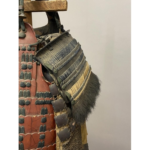 707 - A COLLECTION OF 19TH CENTURY TRADITIONAL JAPANESE ARMOUR. The body armour with chest and back guard ... 